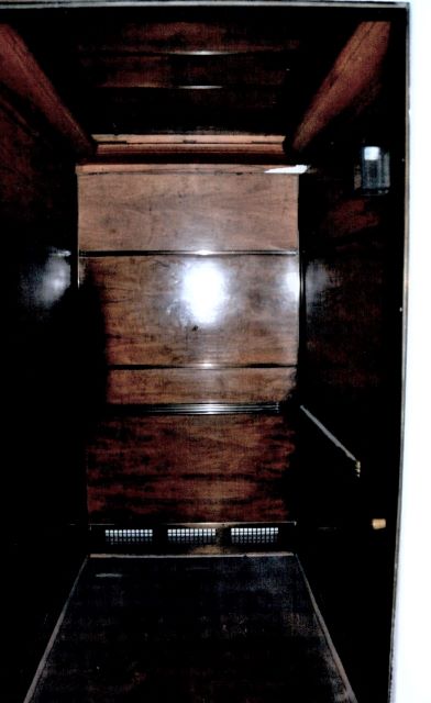 Before: condition of elevator interior before restoration